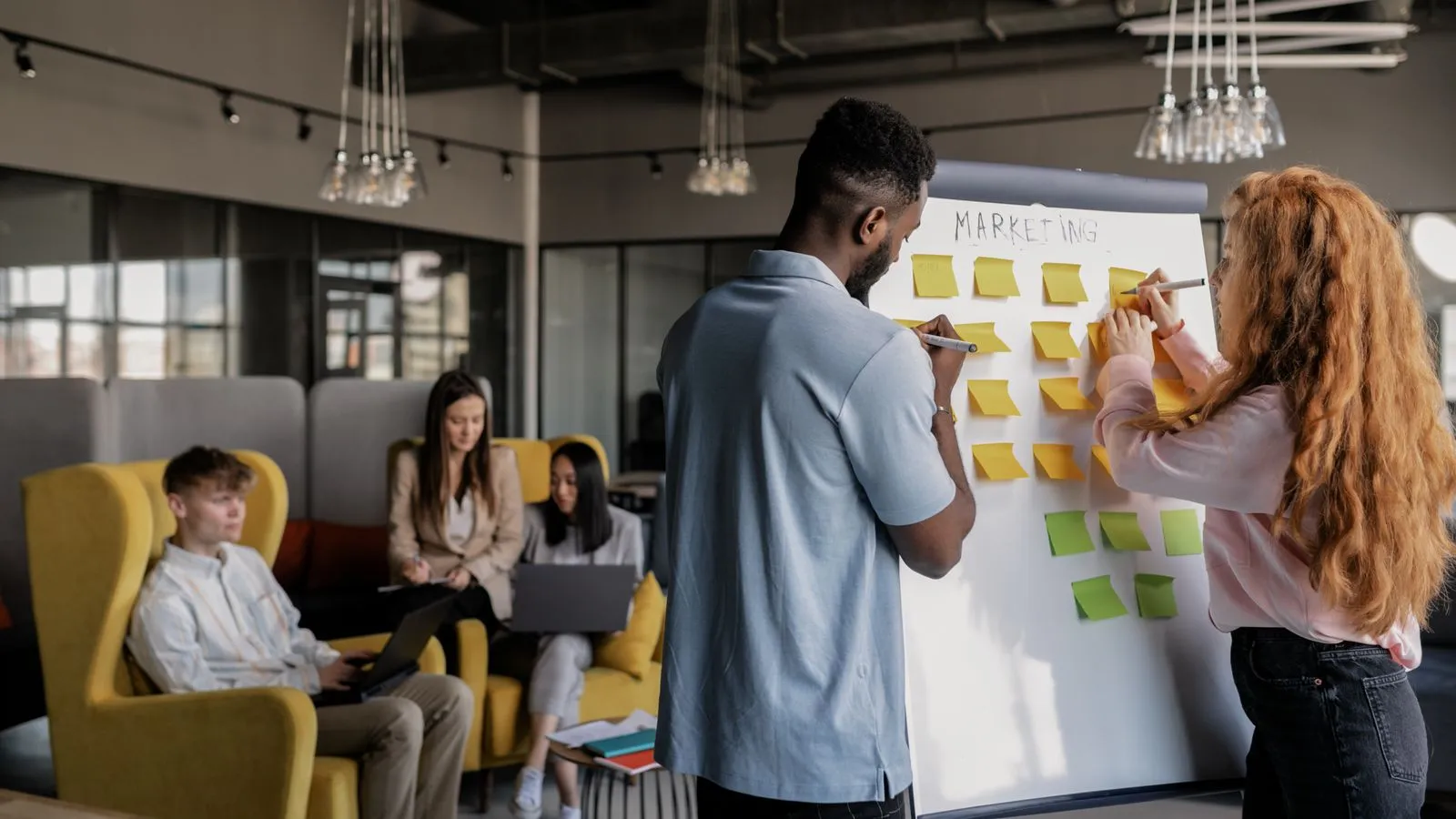 Marketing team reviewing an SEO strategy together in a modern office